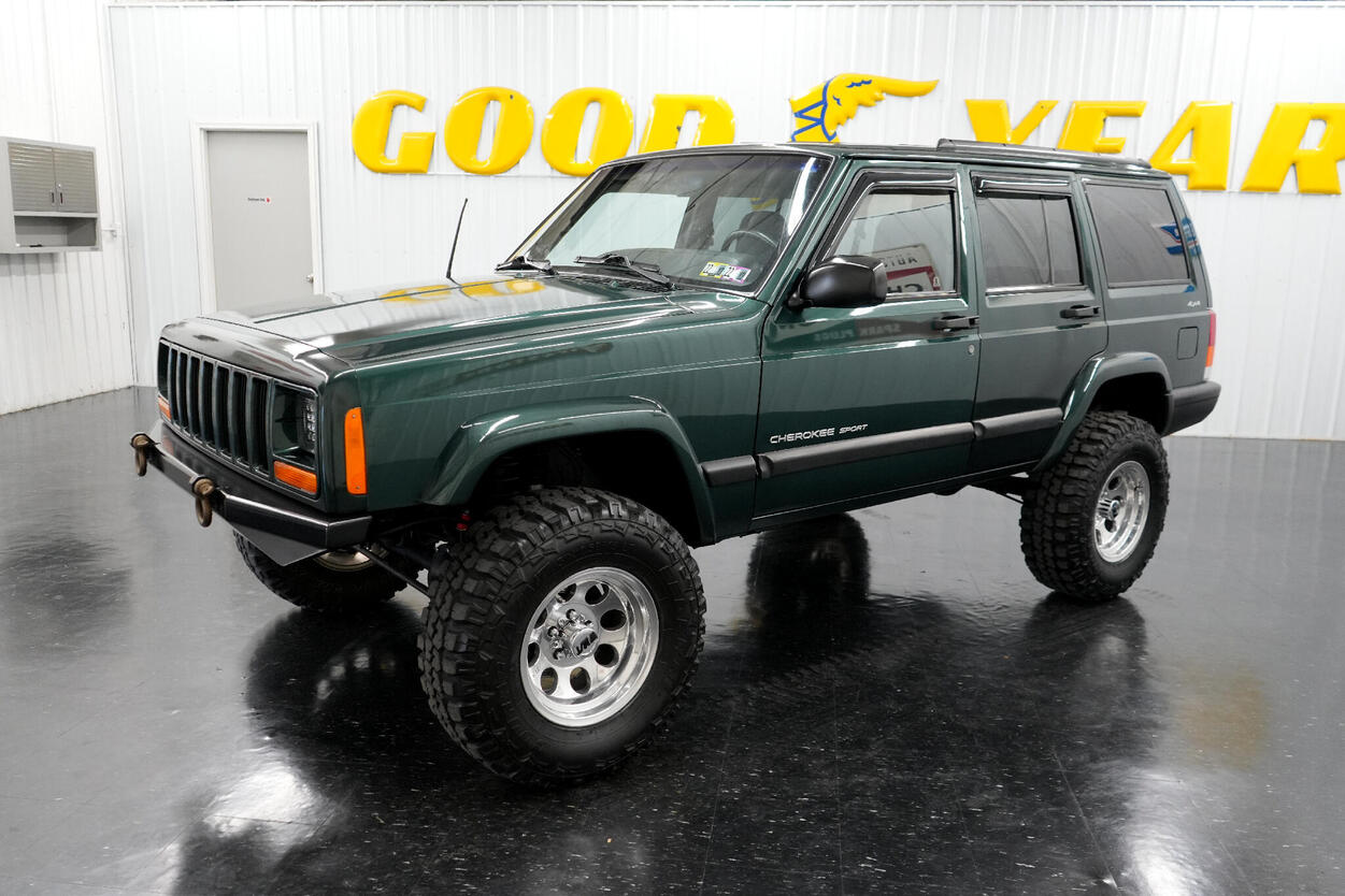 green lifted jeep cherokee